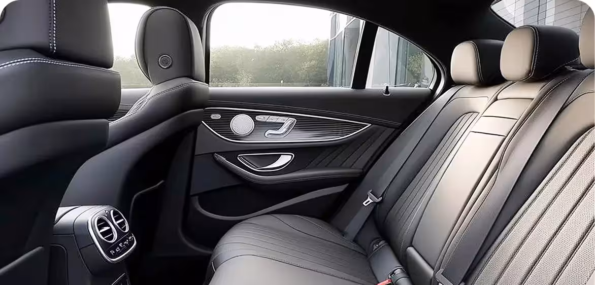 Mercedes Benz E-Class, BMW 5 Series, or similar.